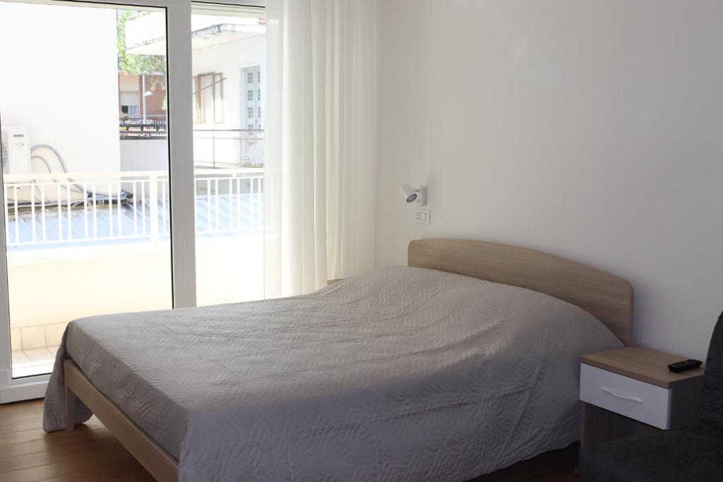 A bed or beds in a room at Antares