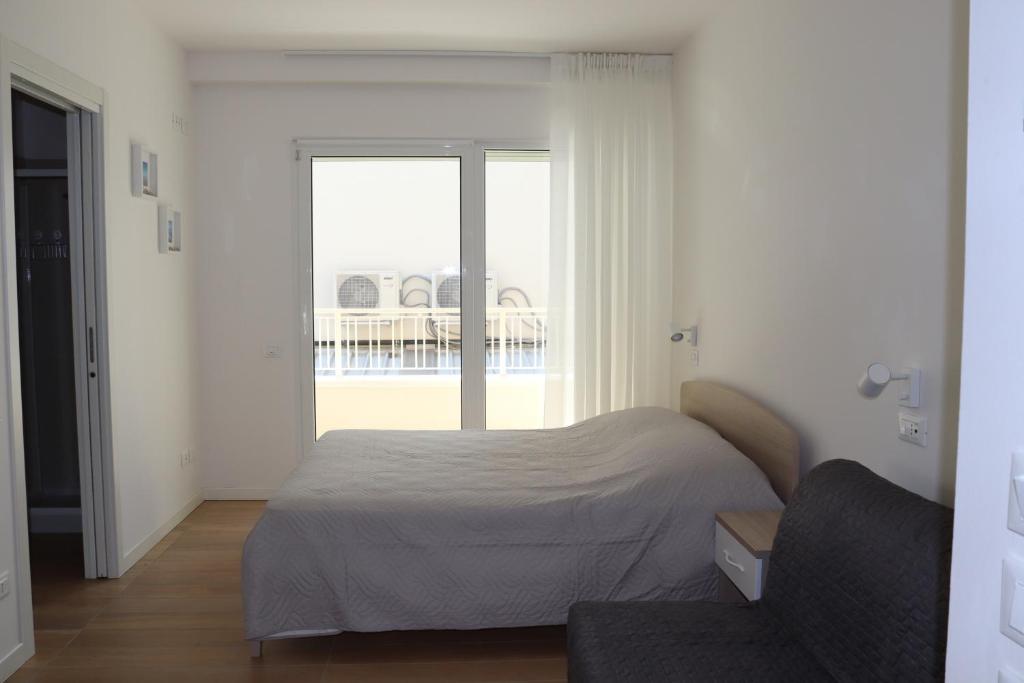 A bed or beds in a room at Antares
