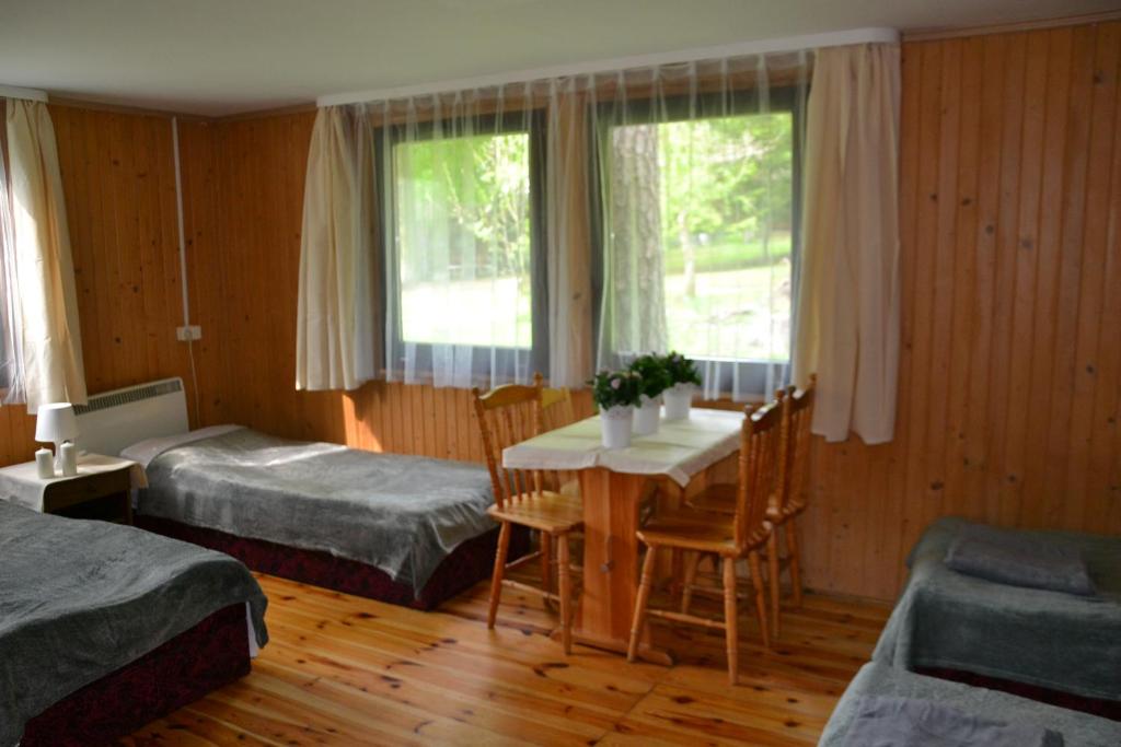 Postel nebo postele na pokoji v ubytování Ośrodek leśny Rajsko w Zapuście