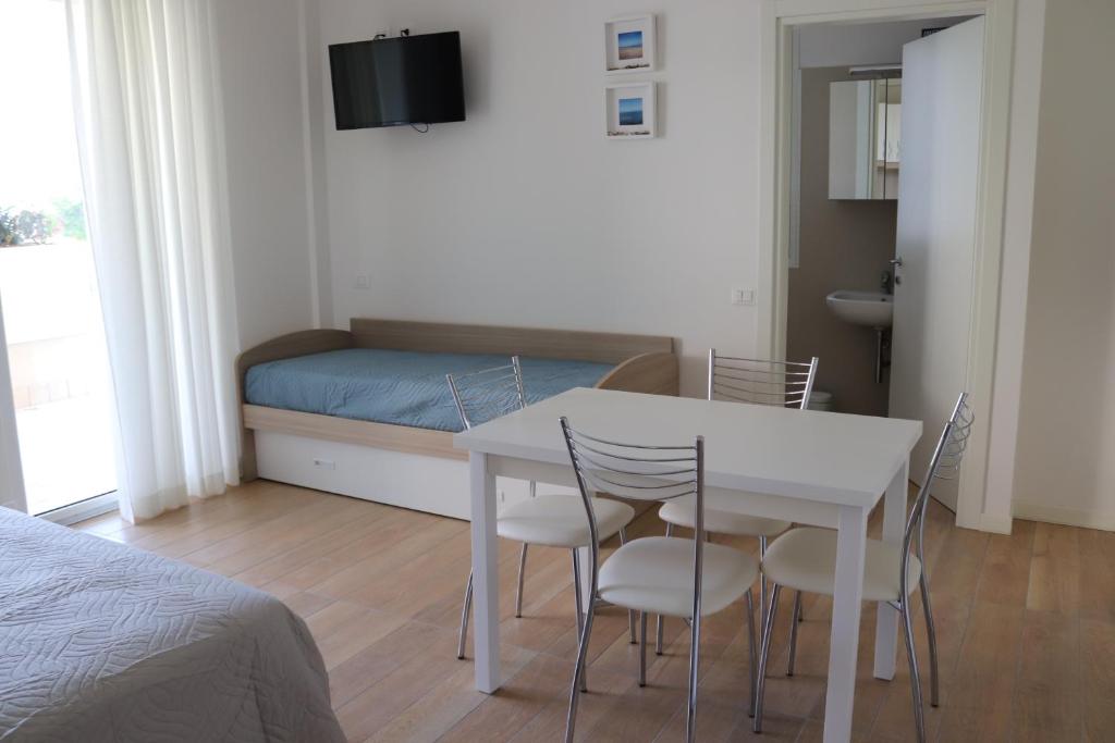 A bed or beds in a room at Antares
