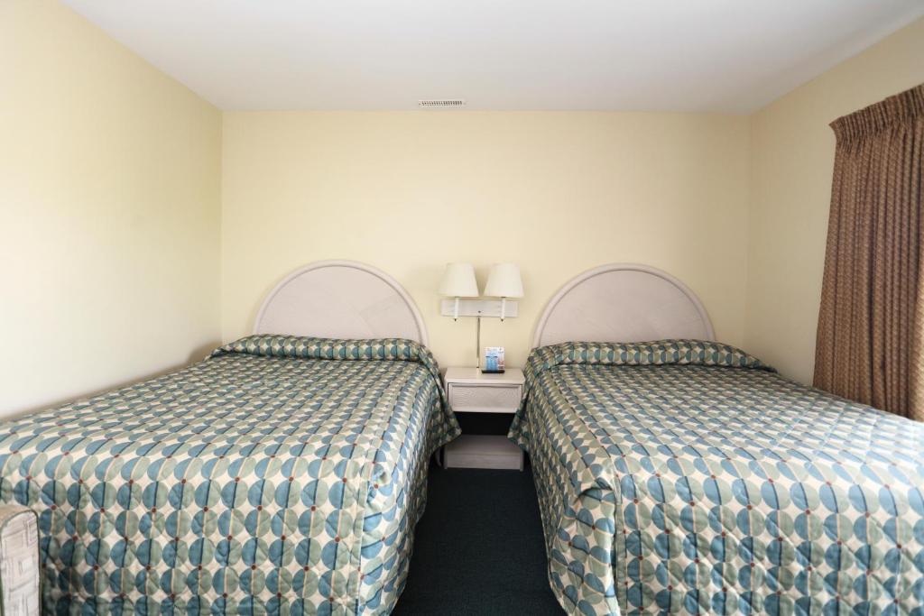 Postel nebo postele na pokoji v ubytování Riviera Resort & Suites