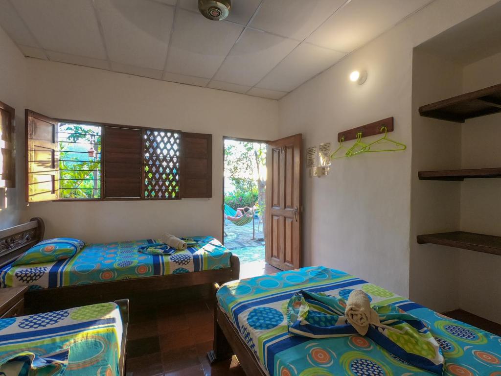Postelja oz. postelje v sobi nastanitve Hostal La Casa de Felipe