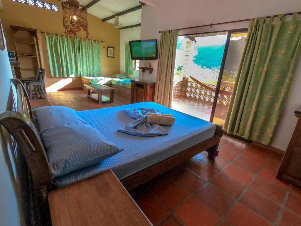 Кровать или кровати в номере Hostal La Casa de Felipe