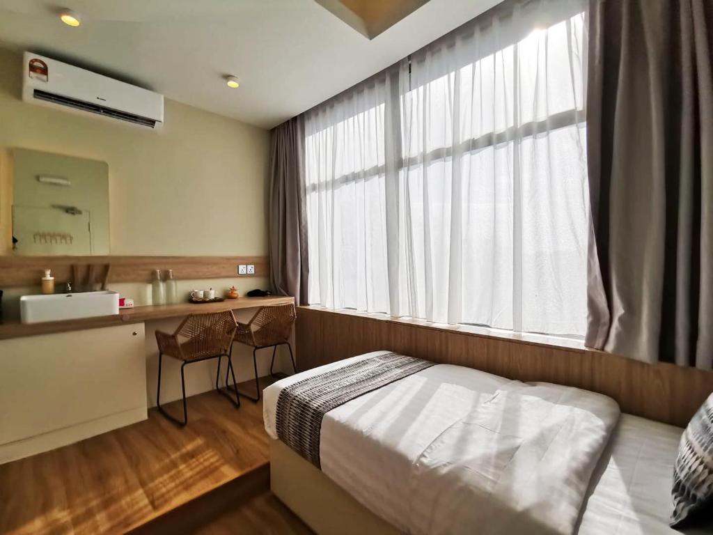Postel nebo postele na pokoji v ubytování Oikos Poshtel