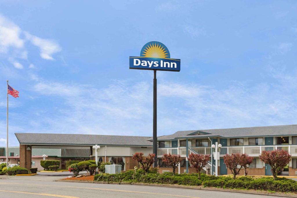 a sign for days inn in front of a building at Days Inn by Wyndham Auburn in Auburn