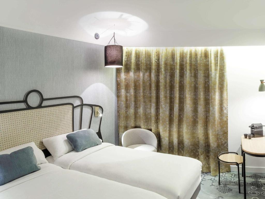 Postel nebo postele na pokoji v ubytování Mercure Orléans Portes de Sologne