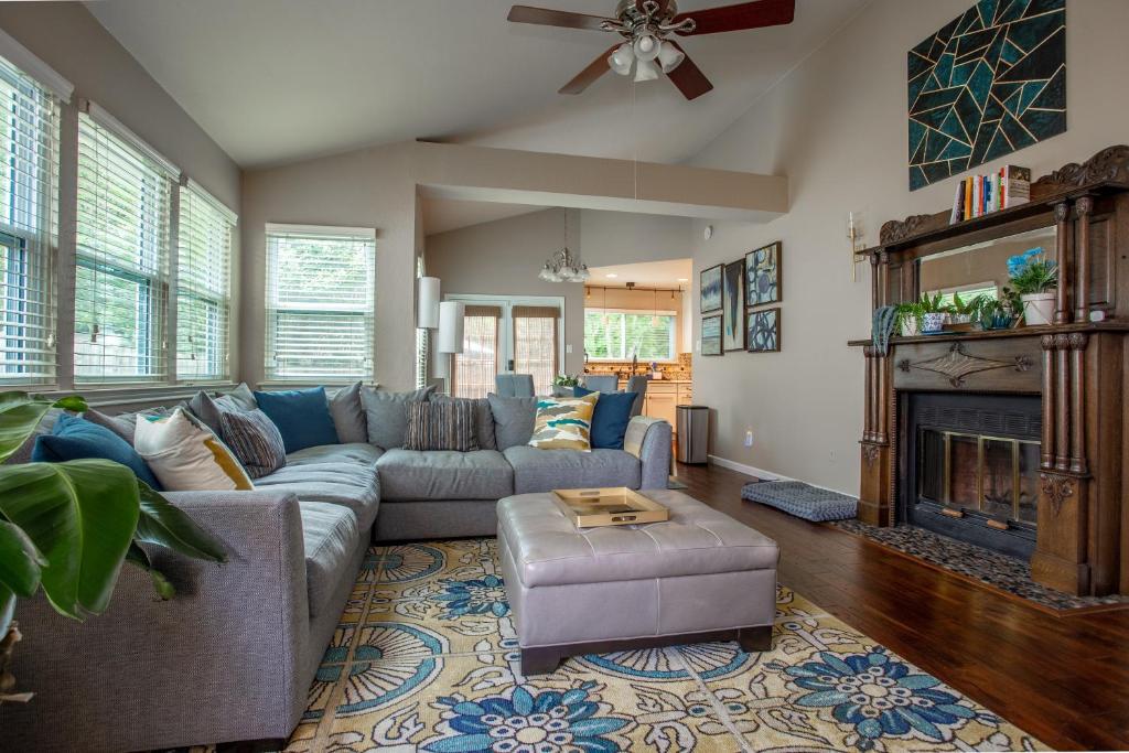 a living room with a couch and a fireplace at Comfortable, Family and Business Friendly 2BD/2BA House in North Austin in Austin