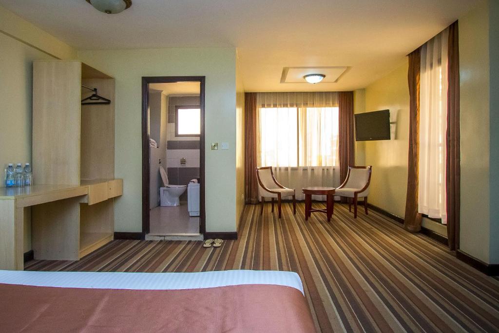 Postel nebo postele na pokoji v ubytování The Clarion Hotel