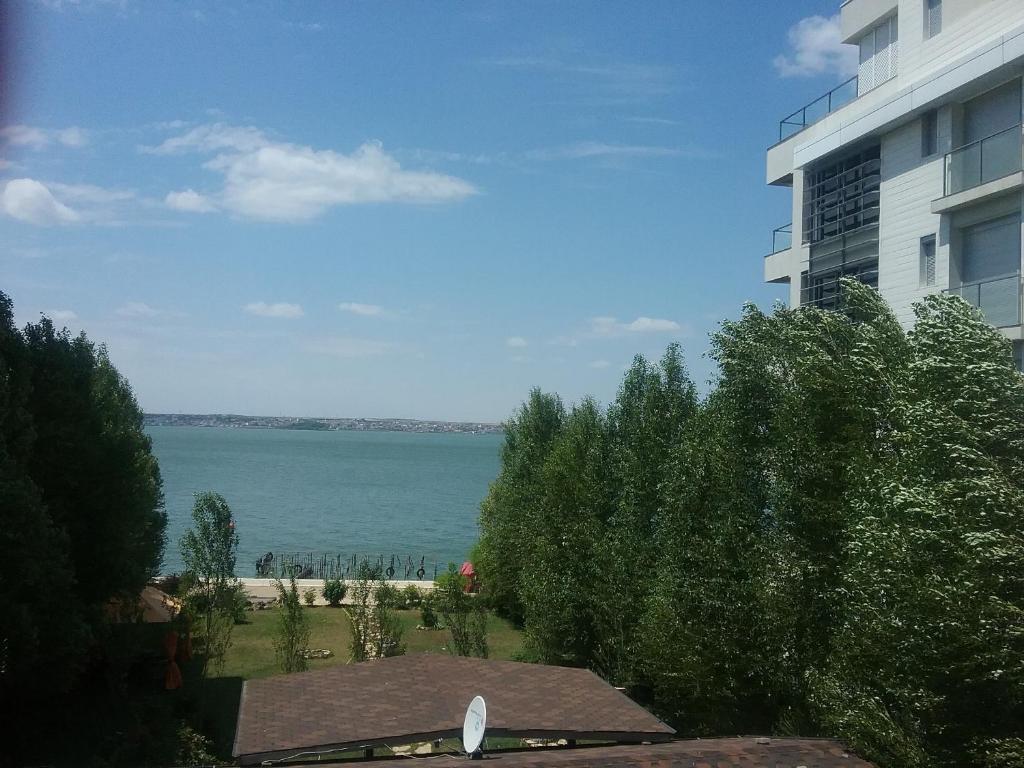 a view of the water from a building at Flory`s Apartment Mamaia in Mamaia