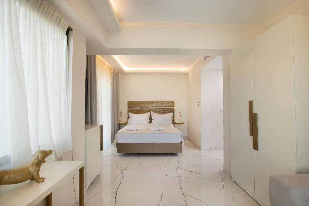 Un pat sau paturi într-o cameră la Laguna Resort Boutique Hotel