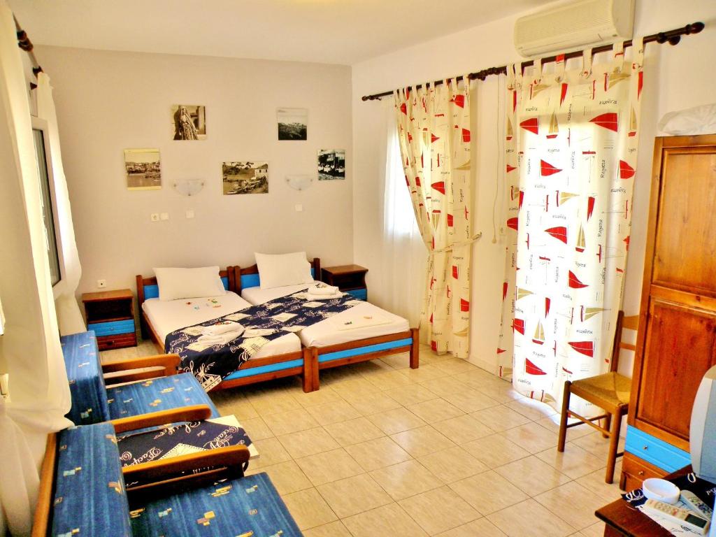 a bedroom with two beds in a room at Studios Elina in Skala Potamias
