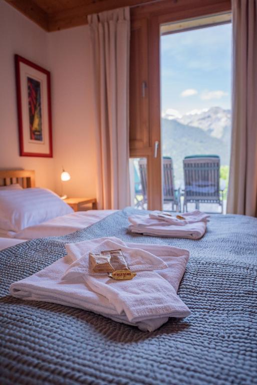 Postel nebo postele na pokoji v ubytování Chalet Roossi 2