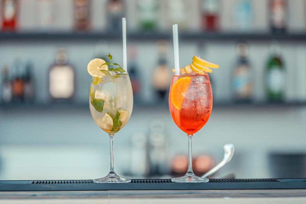 two cocktails sitting on top of a table at Nautilus Hotel in Giardini Naxos