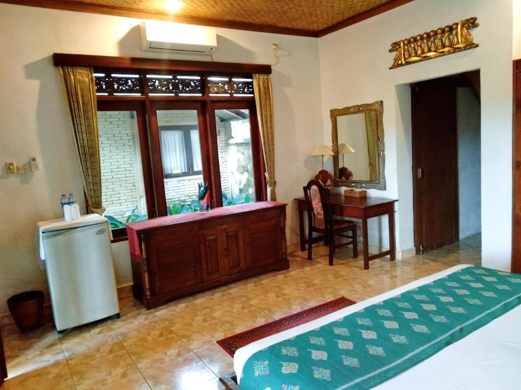 Postel nebo postele na pokoji v ubytování Anomcottages