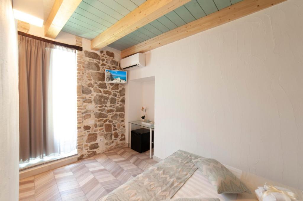 A bed or beds in a room at PERDAS ROOMS