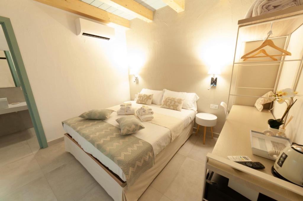 A bed or beds in a room at PERDAS ROOMS