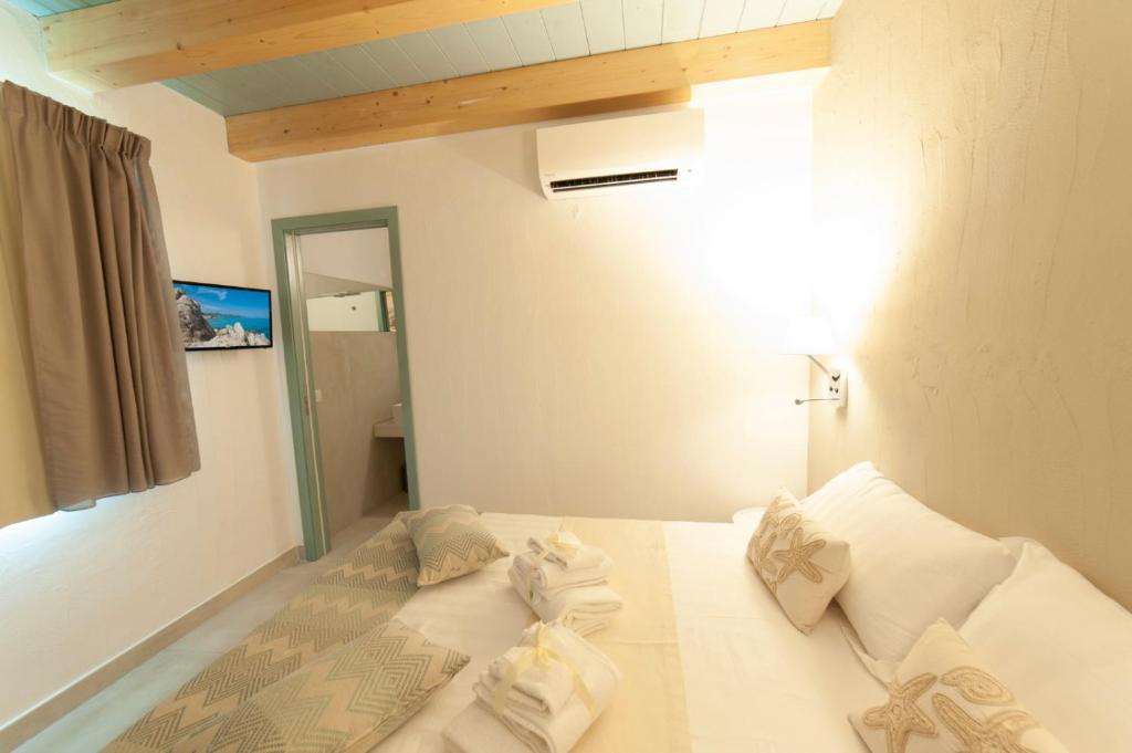 A bed or beds in a room at PERDAS ROOMS