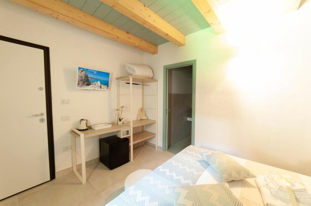 A bed or beds in a room at PERDAS ROOMS