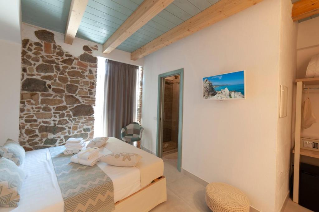 A bed or beds in a room at PERDAS ROOMS