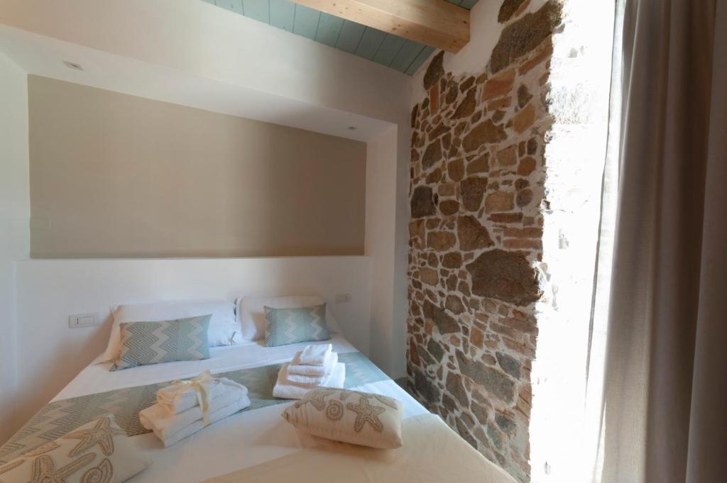 A bed or beds in a room at PERDAS ROOMS