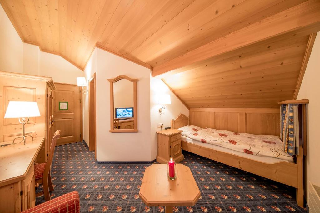 Postel nebo postele na pokoji v ubytování Hotel Alpbach