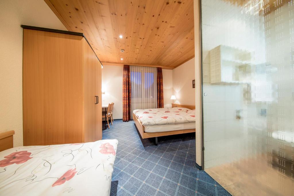 Postel nebo postele na pokoji v ubytování Hotel Alpbach