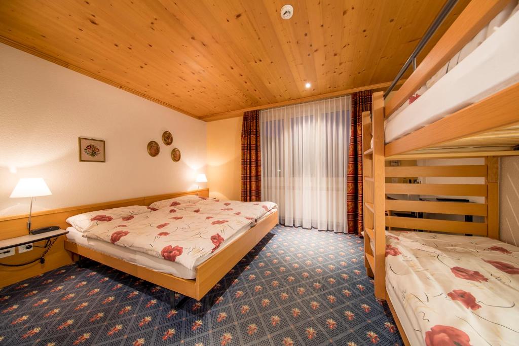 Postel nebo postele na pokoji v ubytování Hotel Alpbach