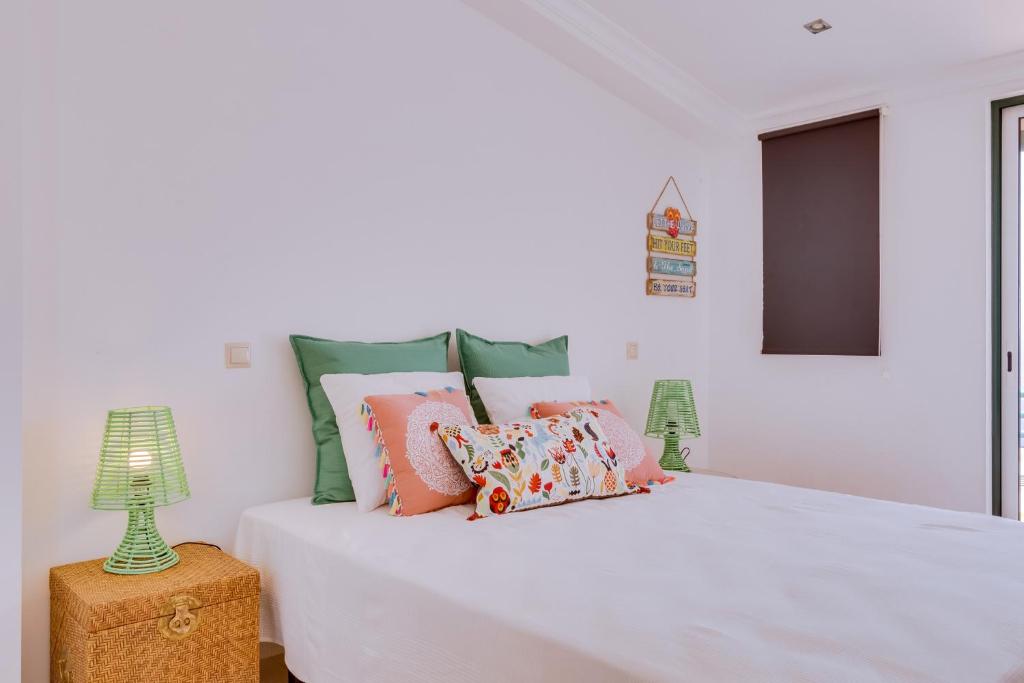 Ένα ή περισσότερα κρεβάτια σε δωμάτιο στο Casa Luz - Quarteira