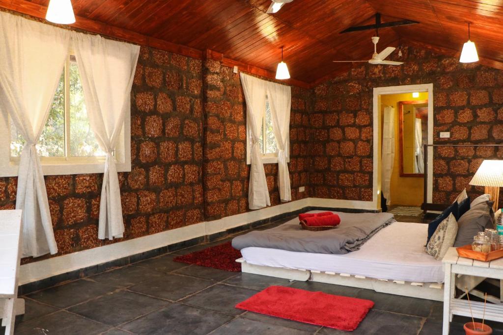 Postel nebo postele na pokoji v ubytování Namaste Jungle - A Boutique Homestay