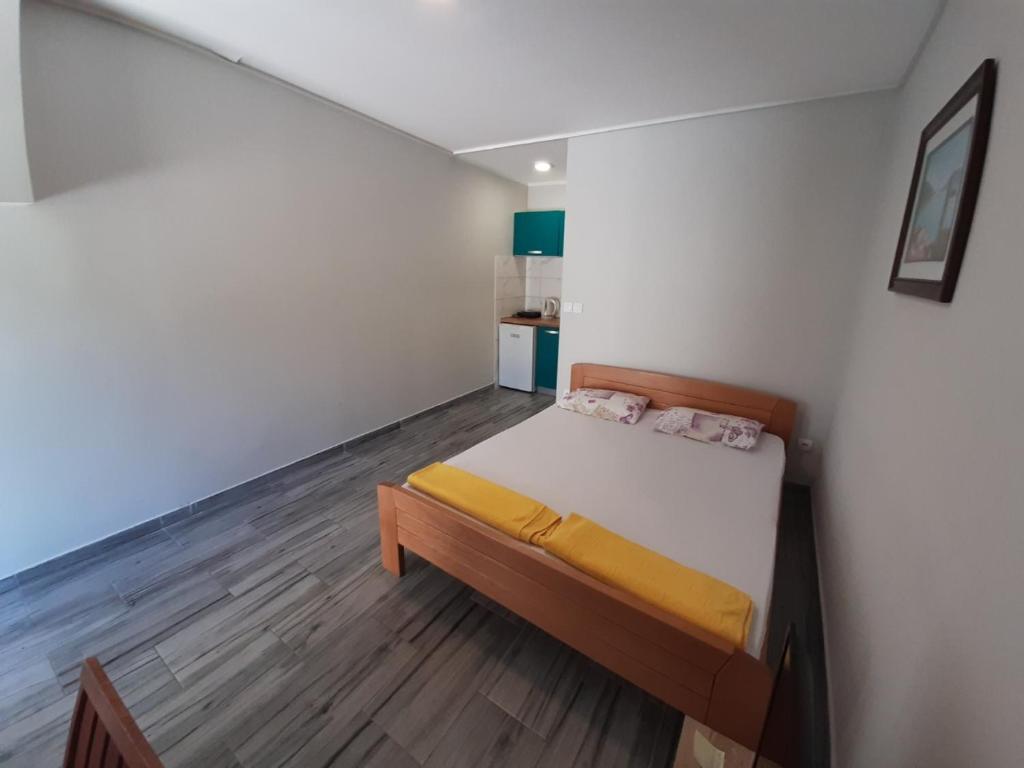 Postel nebo postele na pokoji v ubytování Apartments Dakovic