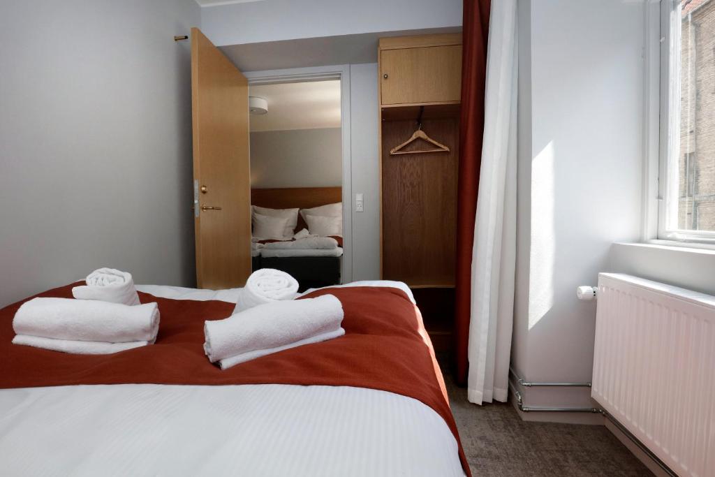 Letto o letti in una camera di Hotel Bethel