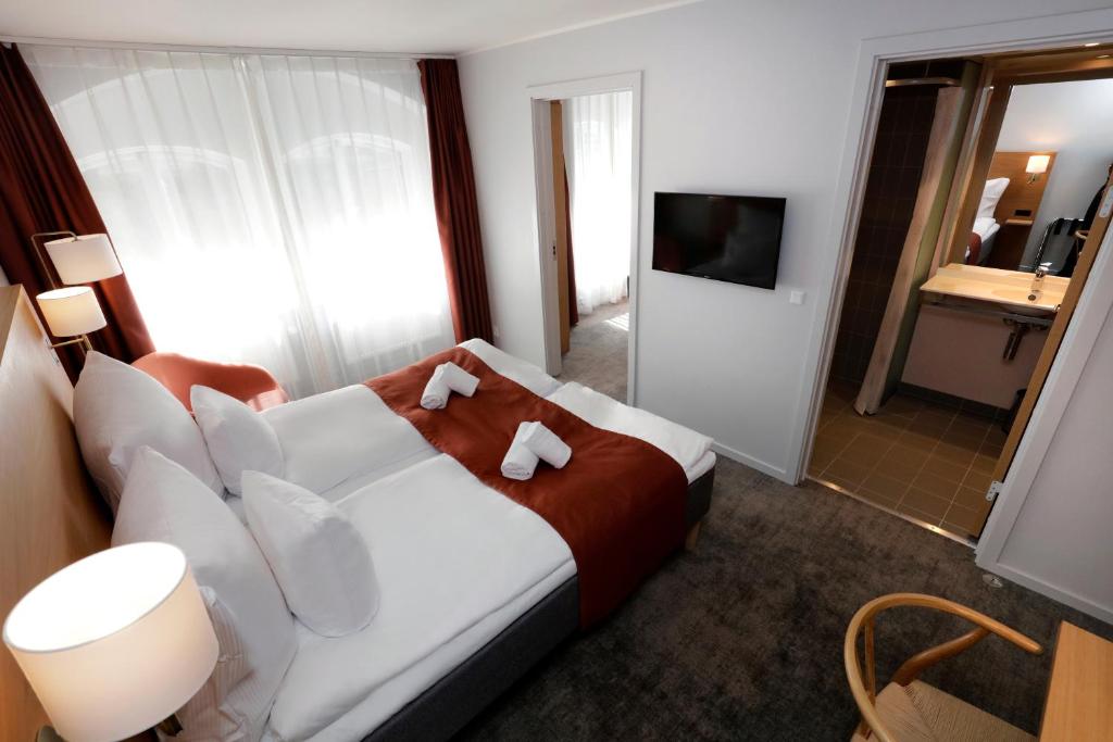 Letto o letti in una camera di Hotel Bethel