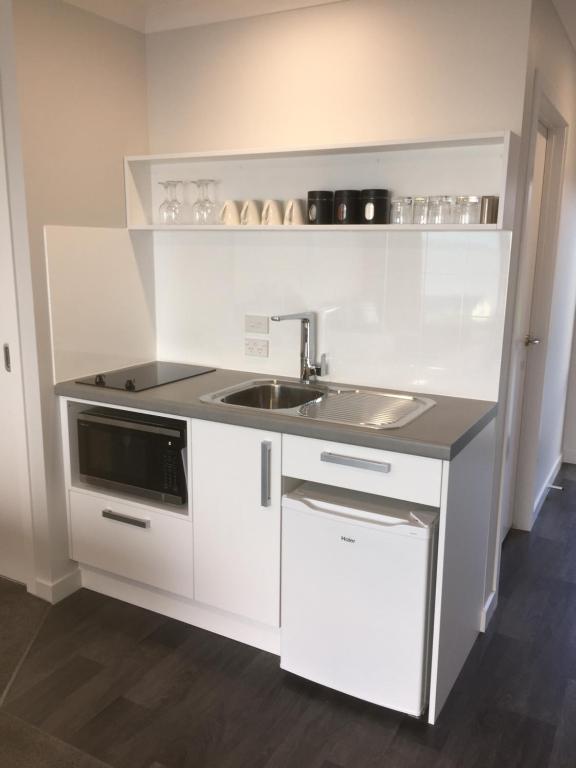 Kuchyň nebo kuchyňský kout v ubytování Kaka Point Views Apartment 2