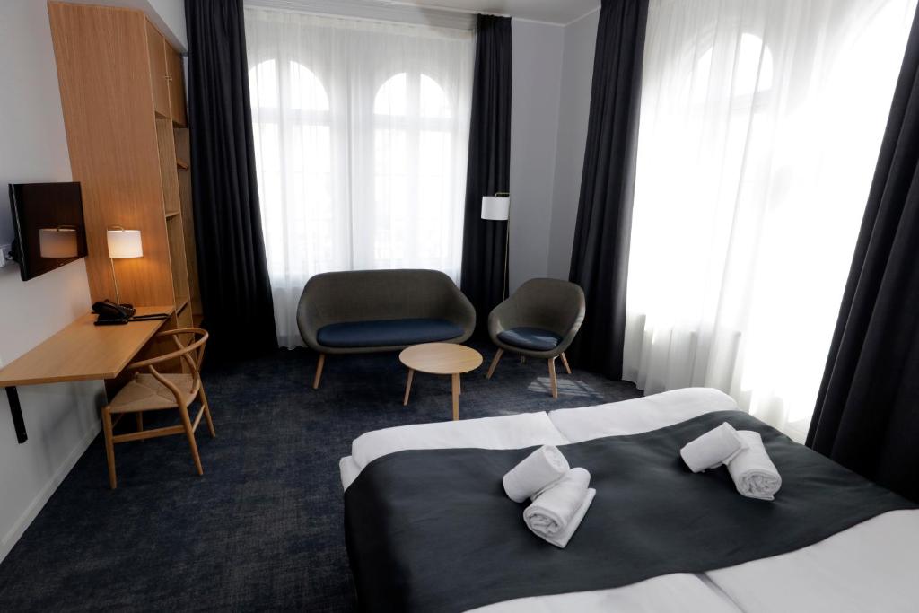 Letto o letti in una camera di Hotel Bethel