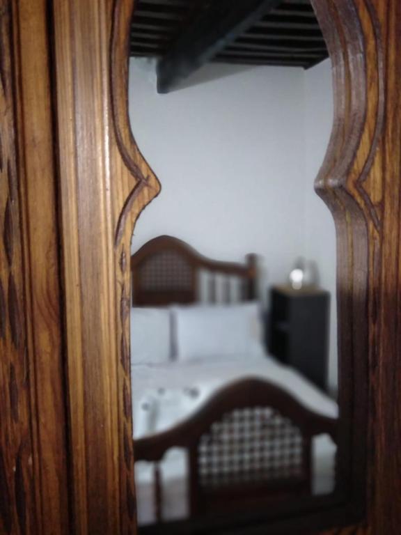 Postel nebo postele na pokoji v ubytování Dar Tsouli