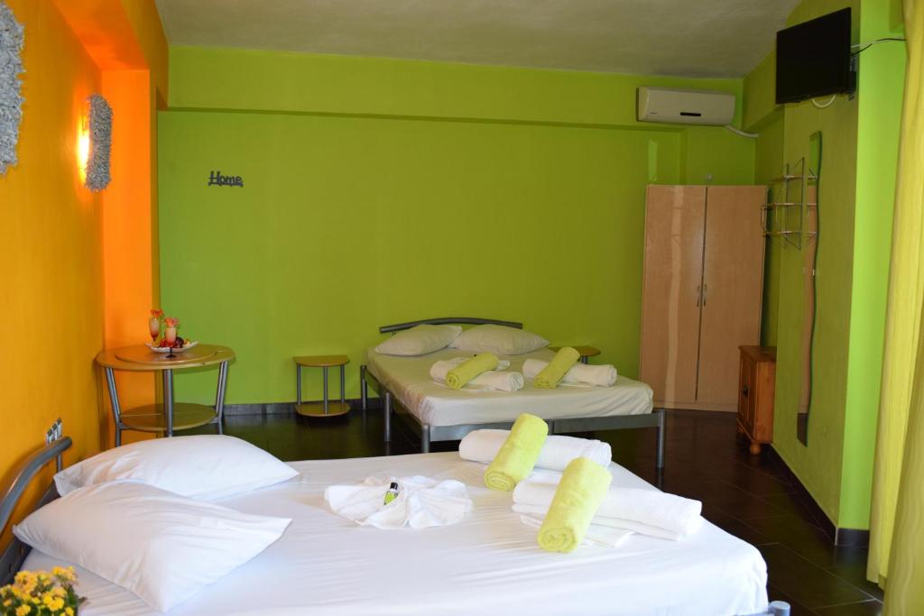 Postel nebo postele na pokoji v ubytování Lilalo Ηotel