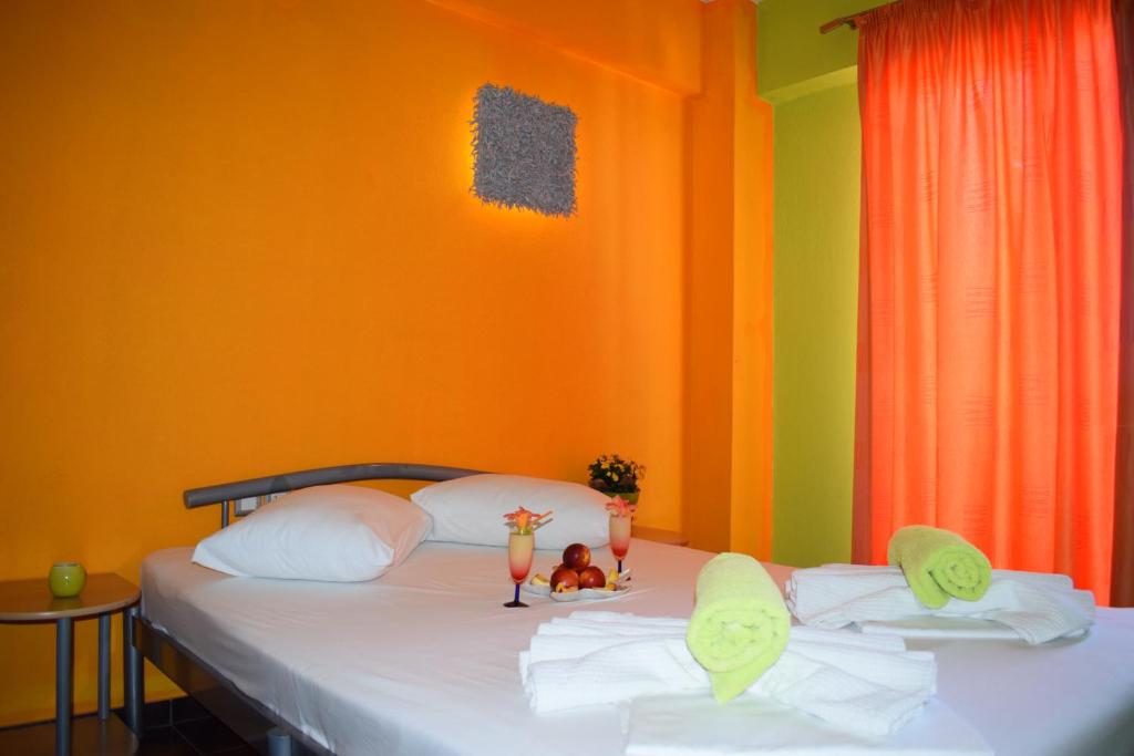 Postel nebo postele na pokoji v ubytování Lilalo Ηotel