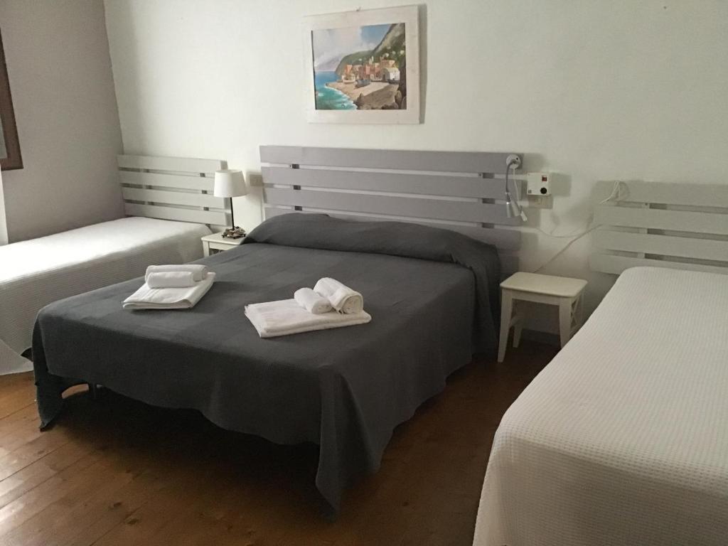 Postel nebo postele na pokoji v ubytování Villa Ghirardelli