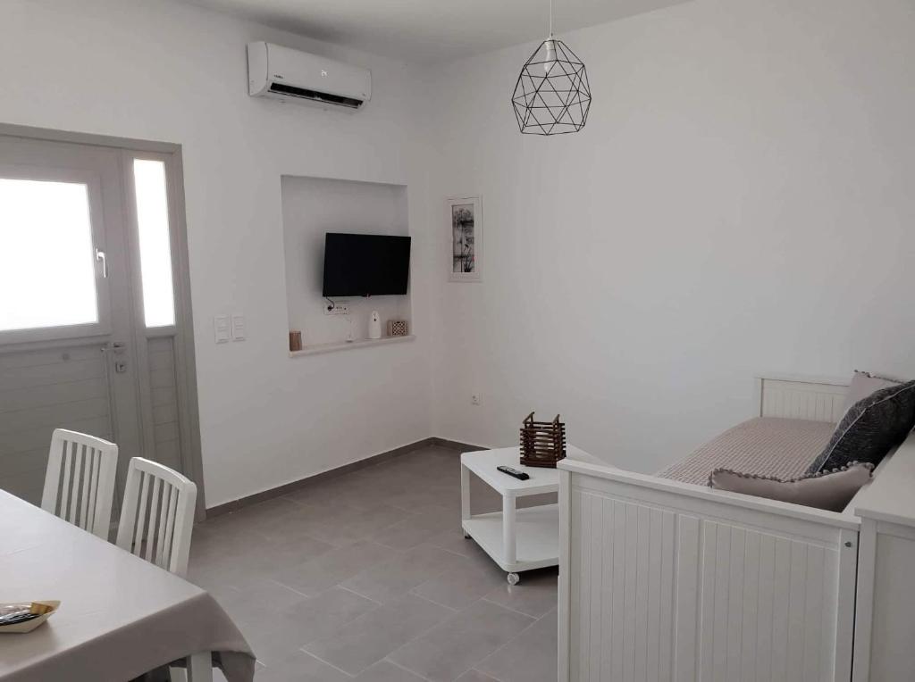 TV a/nebo společenská místnost v ubytování SAND & WAVES HOUSE