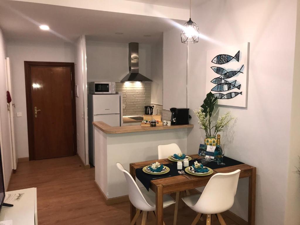 Kuchyň nebo kuchyňský kout v ubytování La Perla Apartment BY NAMASTE ELITE