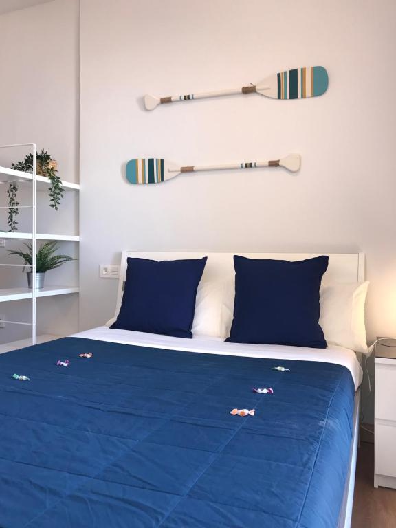 Postel nebo postele na pokoji v ubytování La Perla Apartment BY NAMASTE ELITE