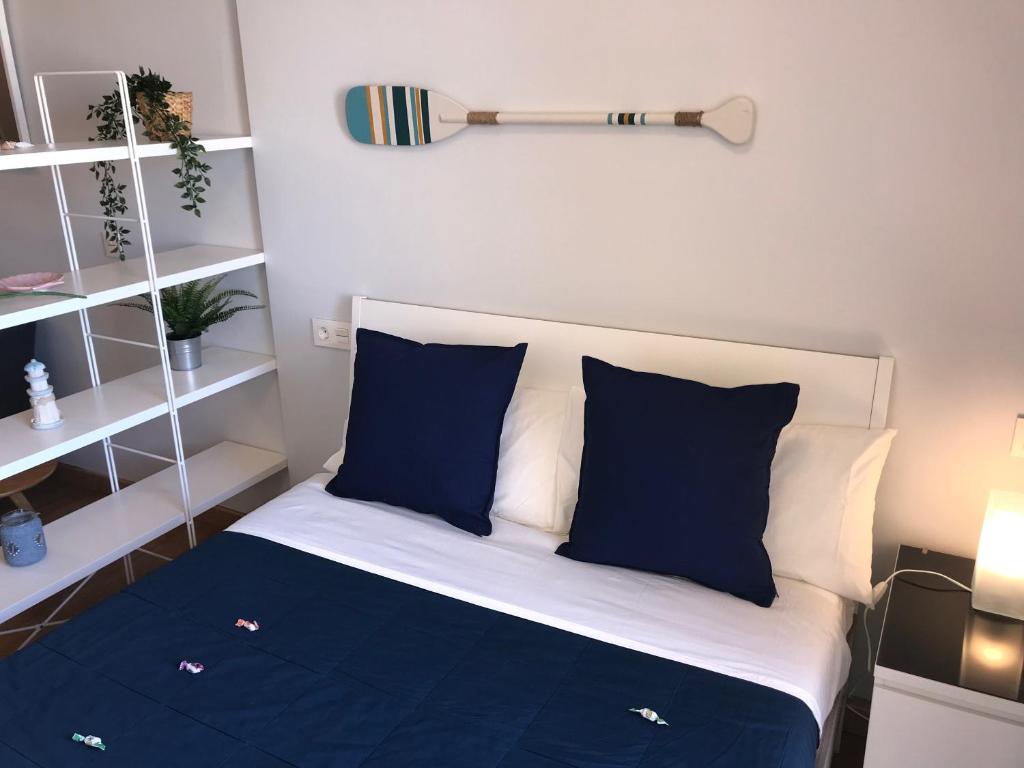 Postel nebo postele na pokoji v ubytování La Perla Apartment BY NAMASTE ELITE