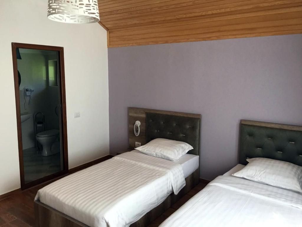 Postel nebo postele na pokoji v ubytování Vila Alexander B&B