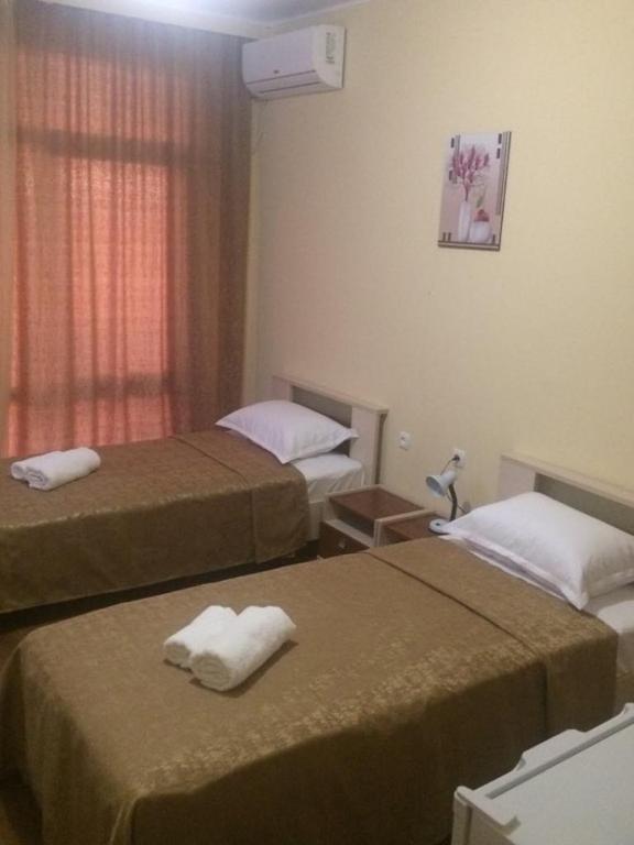 Postel nebo postele na pokoji v ubytování Hotel Medusa