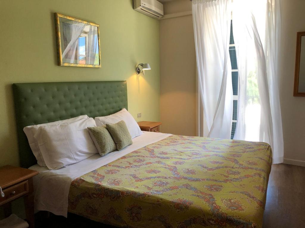 Postel nebo postele na pokoji v ubytování Hotel Antica Stallera