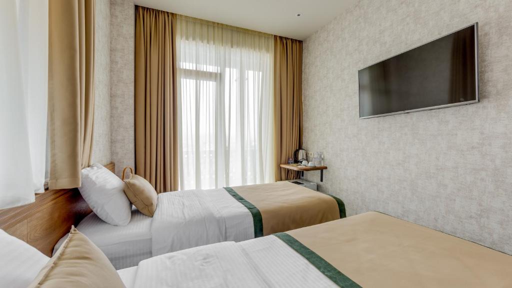 Postel nebo postele na pokoji v ubytování Sole Palace