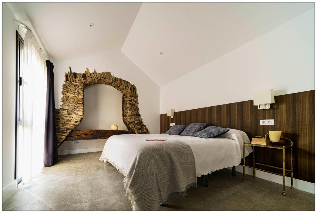 Кровать или кровати в номере La Isla de Próspero