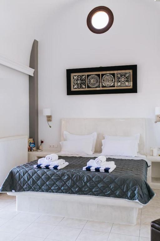 Postel nebo postele na pokoji v ubytování Sun Stories Suites