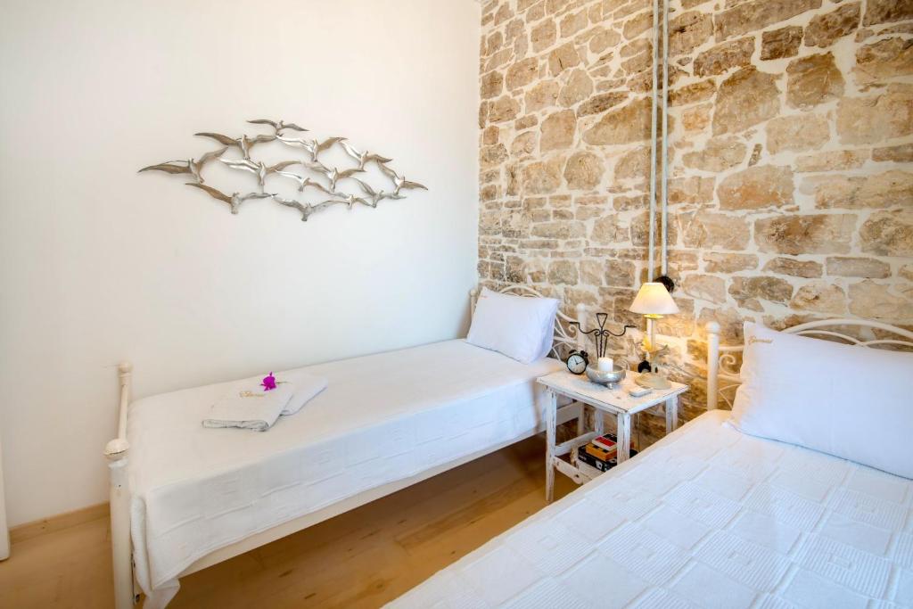 Postel nebo postele na pokoji v ubytování Villa Eleonas