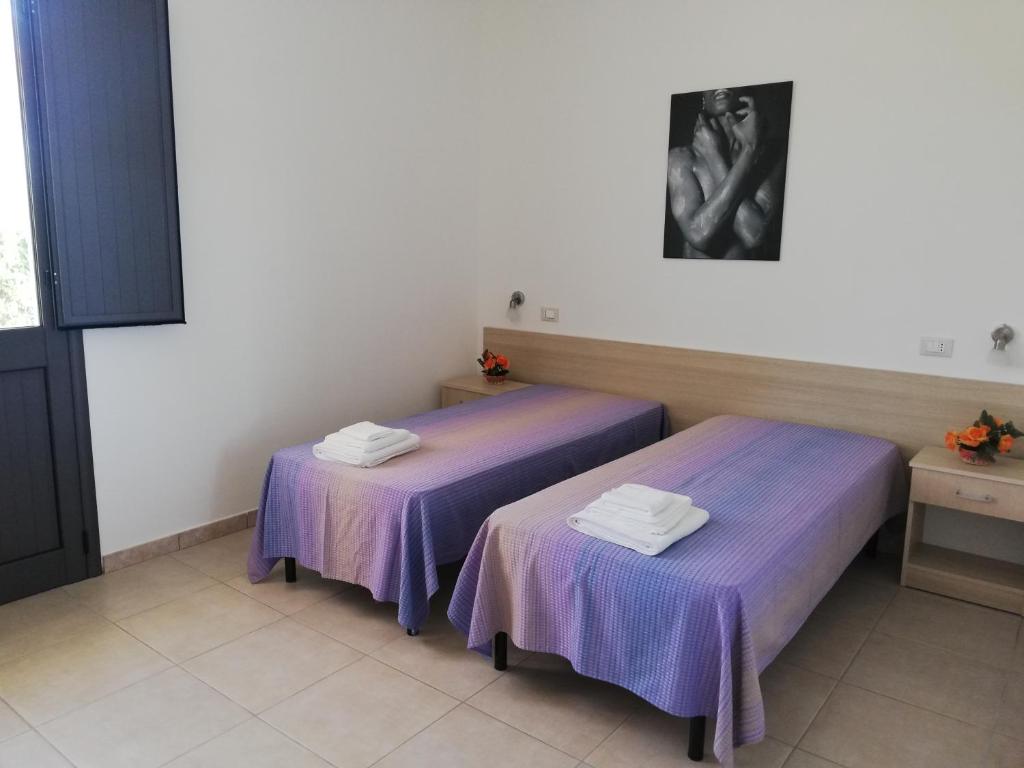 Postel nebo postele na pokoji v ubytování SOLE&MARE agriturismo solo camere